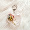Handmade baby’s breath floral charm in clear acrylic case