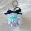 Mint and purple preserved hydrangea floral charm in acrylic case
