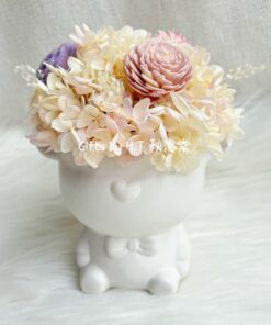 Bear and Bloom preserved flower arrangement in bear ceramic vase