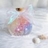 Ocean inspired herbarium aroma bottle with preserved flowers and seashell details